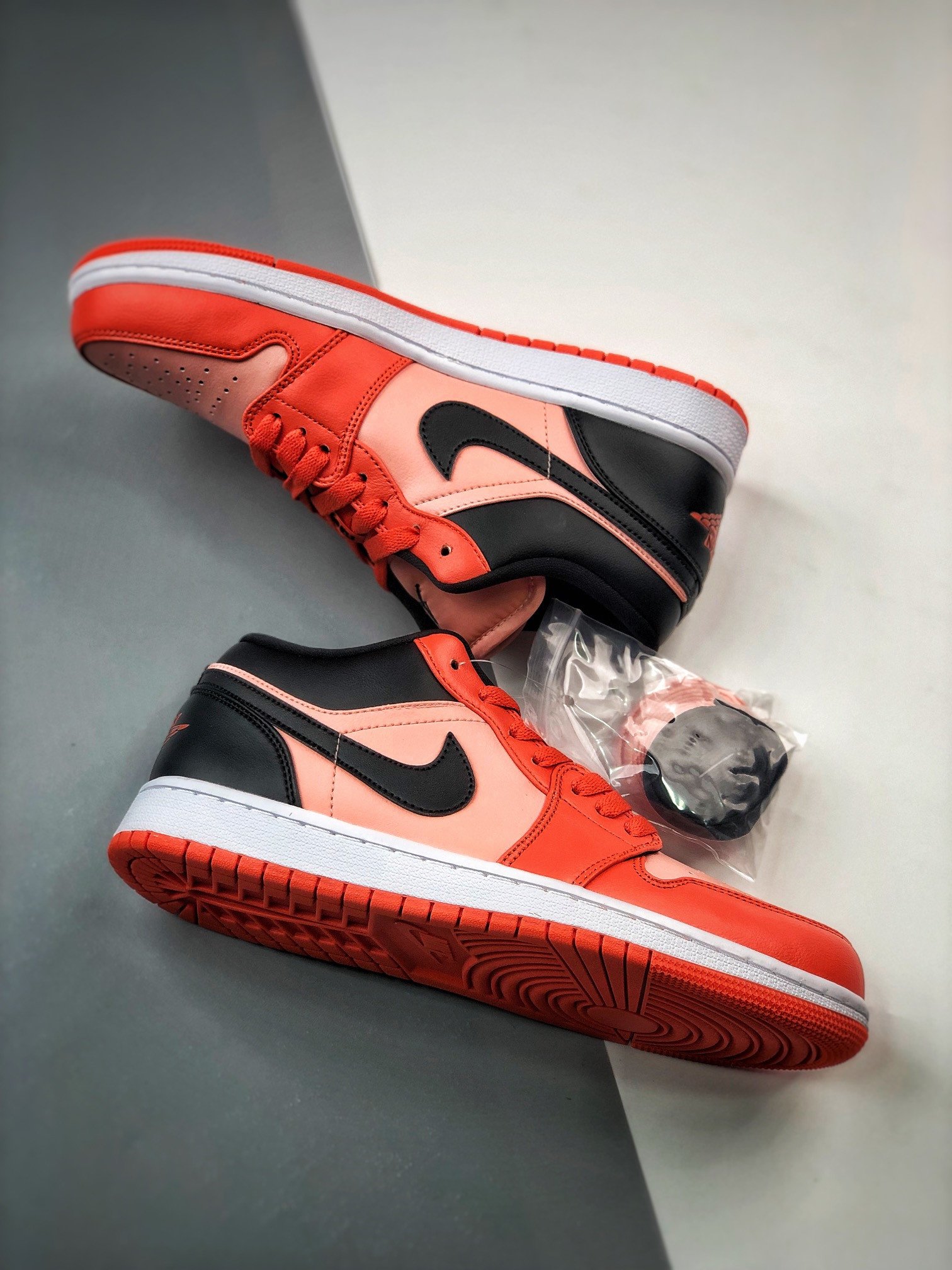black and orange jordan 1 low